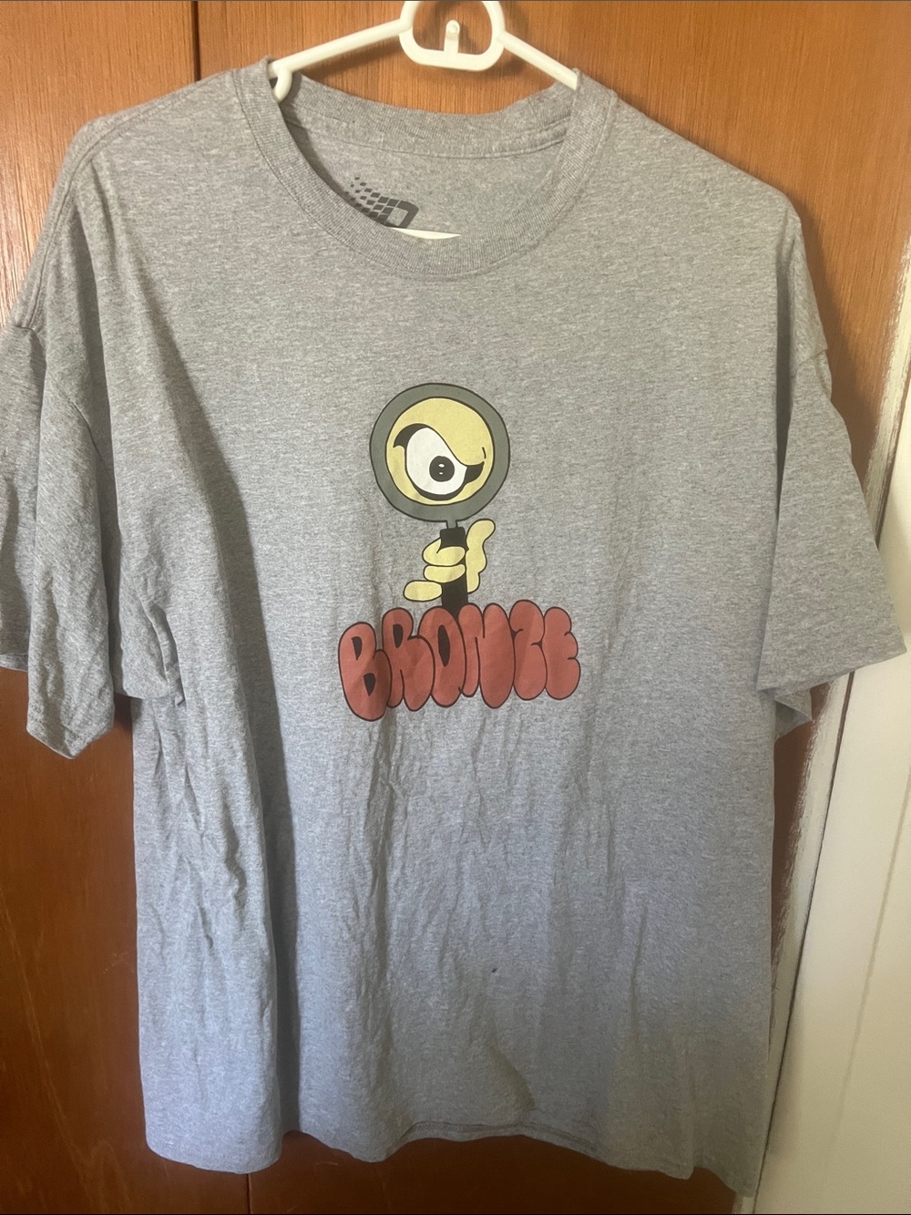 Bronze “Detective” Tee